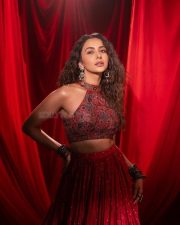 Sexy Actress Rakul Preet Singh in a Red and Maroon Embroidered Halter Neck Crop Top with a Matching Flared Lehenga Skirt Photos 01