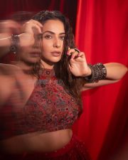 Sexy Actress Rakul Preet Singh in a Red and Maroon Embroidered Halter Neck Crop Top with a Matching Flared Lehenga Skirt Photos 04
