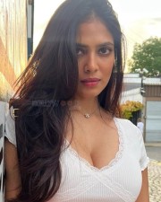 Sexy Beauty Malavika Mohanan in a White Crop Top Cleavage Photos 03