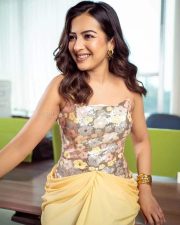 Sexy Catherine Tresa in a Floral Embroidered Corset Top with a Yellow Draped Skirt at Phani Movie Press Meet Stills 02