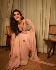 Sexy Hot Karishma Tanna in a Light Pink Transparent Saree with a Black Sleeveless Cleavage Blouse Pictures 01
