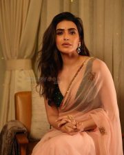 Sexy Hot Karishma Tanna in a Light Pink Transparent Saree with a Black Sleeveless Cleavage Blouse Pictures 03