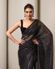 Sexy Karishma Tanna in a Black Shimmery Saree with a Sleeveless Blouse Photos 01