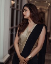 Sexy Keerthy Suresh in a Black Saree With a Bold Golden Vest Photos 01