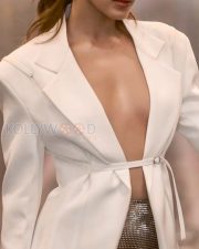 Sexy Kiara Advani in a Jacquemus white jacket and a mini silver bling skirt with a slit from Monisha Jaising Photos 02