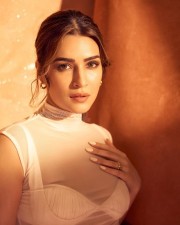 Sexy Kriti Sanon in a Transparent Crop Top with White Bra and Cream Maxi Dress Pictures 03