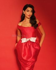 Sexy Nora Fatehi in a Red Off Shoulder Dress with a Large White Bow at the Waist Dress Photos 04