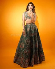 Sexy Pooja Hegde in a Mudra Green Lehenga with Organza Dupatta with Resham and Zardozi Embroidery Plunging Scalloped Neckline Photos 03