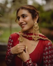 Sexy Priya Prakash Varrier in a Deep Red Printed Salwar Suit Photos 01