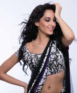 Sexy Singer and Dancer Nora Fatehi Black Saree Photoshoot Pictures 01