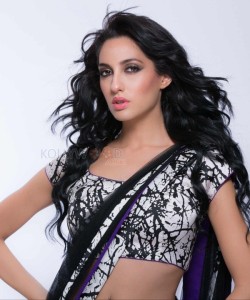 Sexy Singer and Dancer Nora Fatehi Black Saree Photoshoot Pictures 08