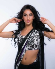 Sexy Singer and Dancer Nora Fatehi Black Saree Photoshoot Pictures 09