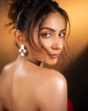 Sizzling Hot Rakul Preet Singh in a Red Corset Strapless Top with a Thigh High Slit Skirt Photos 04