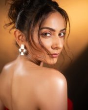 Sizzling Hot Rakul Preet Singh in a Red Corset Strapless Top with a Thigh High Slit Skirt Photos 04