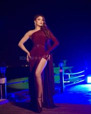 Sizzling Urvashi Rautela in a Maroon One Shoulder Thigh Slit Gown Photos 01