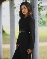 Sophisticated Actress Catherine Tresa in a Black Long Sleeve Wrap Dress Photos 01