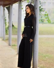 Sophisticated Actress Catherine Tresa in a Black Long Sleeve Wrap Dress Photos 03