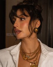 Sophisticated Actress Nora Fatehi in a White knotted shirt and flared denim skirt Photos 05 Sophisticated Actress Nora Fatehi in a White knotted shirt and flared denim skirt Photos 05