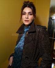 Sophisticated Kriti Sanon in a Dark Brown Trench Coat with a Blue Silk Tie Style Scarf Pictures 02