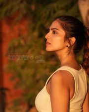 Sophisticated Malavika Mohanan in a Off White Tank Top with a Khaki Bottoms Pictures 01