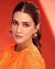 Sparkling Actress Kriti Sanon in an Orange Sequin Mini Dress Photos 04