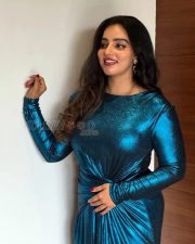 Sparkling Actress Malavika Menon in a Teal Metallic Bodycon Dress Photos 01
