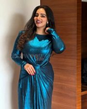 Sparkling Actress Malavika Menon in a Teal Metallic Bodycon Dress Photos 02