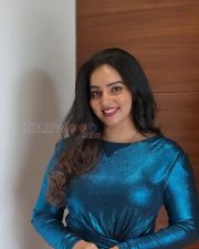 Sparkling Actress Malavika Menon in a Teal Metallic Bodycon Dress Photos 04