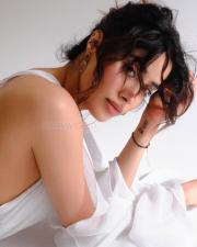 Spellbinding Actress Janhvi Kapoor in a White Sleeveless Dress Photos 01
