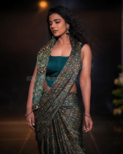 Striking Actress Aishwarya Rajesh in a Deep Green Printed Saree Teal Blouse Photos 01