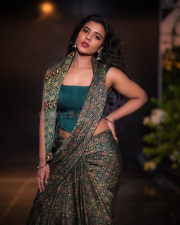 Striking Actress Aishwarya Rajesh in a Deep Green Printed Saree Teal Blouse Photos 03