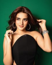 Striking Actress Nidhhi Agerwal in a Black Strapless Cutout Top Photos 04
