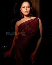 Striking Actress Nushrratt Bharuccha in a Burgundy Metallic One Shoulder Gown Photos 04