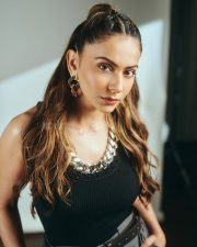 Striking Actress Rakul Preet Singh in a Black ribbed tank top and grey wide leg trousers Photos 01