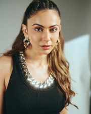 Striking Actress Rakul Preet Singh in a Black ribbed tank top and grey wide leg trousers Photos 02