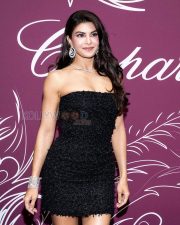 Stunning Actress Jacqueline Fernandez in a Black Strapless Feathered Mini Dress Photos 02
