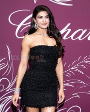 Stunning Actress Jacqueline Fernandez in a Black Strapless Feathered Mini Dress Photos 02