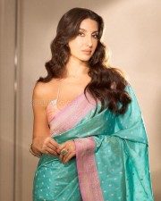 Stunning Actress Nora Fatehi in a Turquoise Banarasi Silk Saree Pictures 01