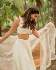 Stunning Actress Pooja Hegde in a White Bridesmaid Lehenga Photos 01