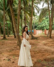 Stunning Actress Pooja Hegde in a White Bridesmaid Lehenga Photos 04