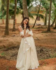 Stunning Actress Pooja Hegde in a White Bridesmaid Lehenga Photos 05