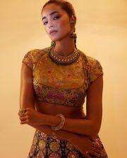 Stunning Ananya Panday in a Black Hand Embroidered Lehenga with a High Neck Mustard Yellow Blouse Photos 02