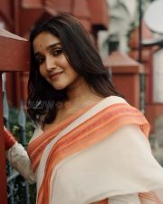 Stunning Anikha Surendran in a White Saree with an Orange Border Pictures 01