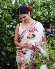 Stunning Beauty Malavika Mohanan in a White Floral Monochromatic Saree with Sleeveless Blouse Photos 02