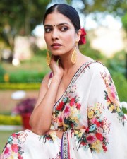 Stunning Beauty Malavika Mohanan in a White Floral Monochromatic Saree with Sleeveless Blouse Photos 03