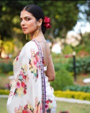 Stunning Beauty Malavika Mohanan in a White Floral Monochromatic Saree with Sleeveless Blouse Photos 05
