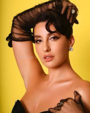 Stunning Bold Nora Fatehi in a BLack Corset Dress with Elbow Length Gloves Photos 01