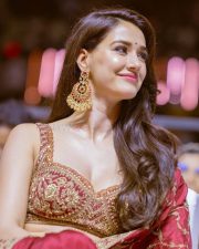 Stunning Disha Patani in a Red Saree with a Bralette Blouse Pictures 09