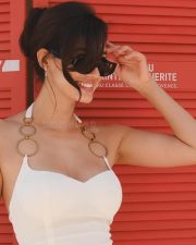 Stunning Disha Patani in a White Mini Halter Neck with a Metal Ring Dress 02