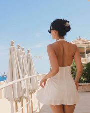 Stunning Disha Patani in a White Mini Halter Neck with a Metal Ring Dress 04